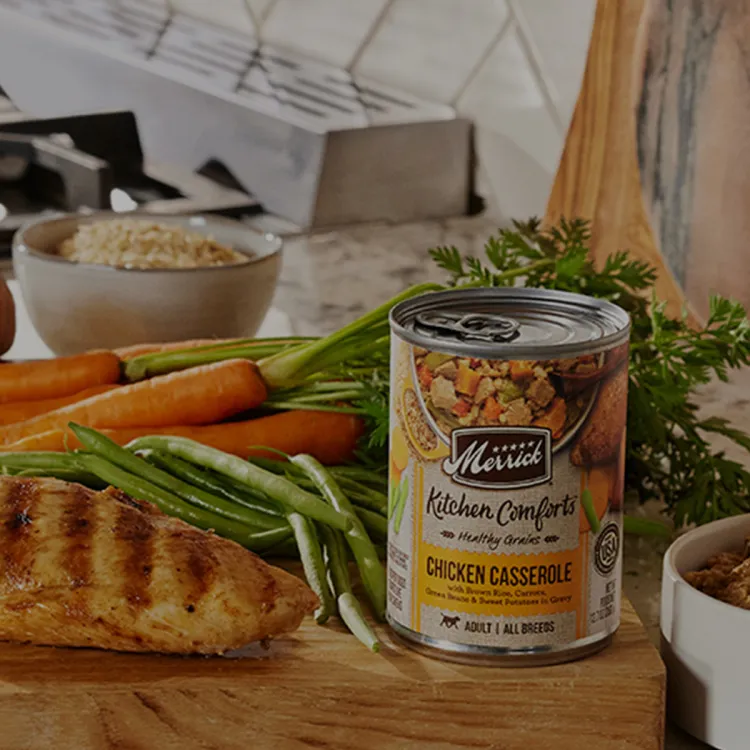 A can of food on a cutting board